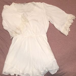 Beautiful white romper. Never worn.